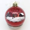 red christmas bauble with handpainted motive