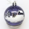 handmålad christmas bauble with a winter scene