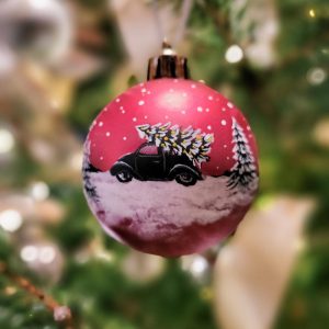 christmas bauble with a car and christmas tree on top