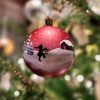 christmas bauble with a winter landscape, santas helper and barn